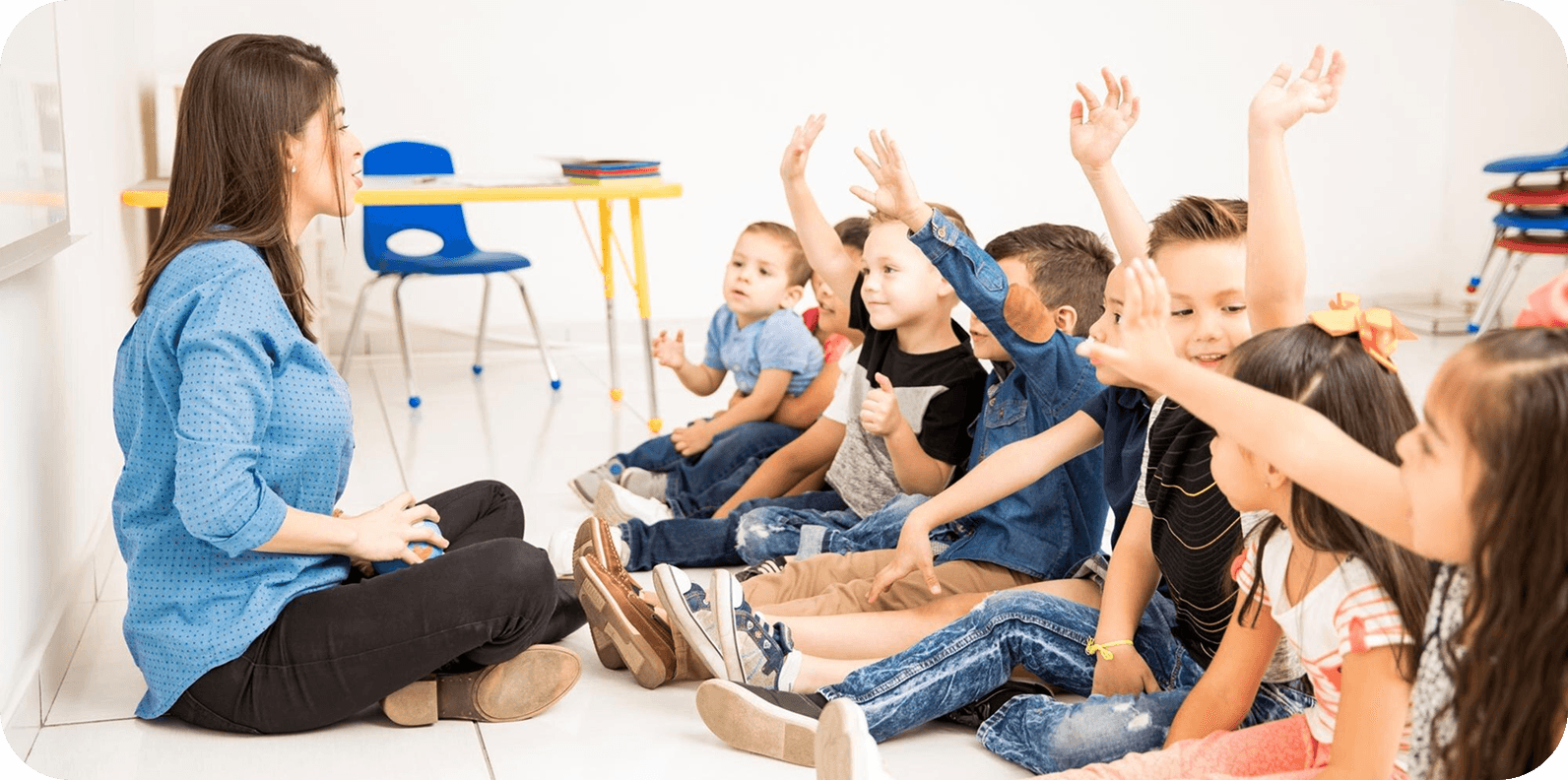 Teacher with children in classroom circle time