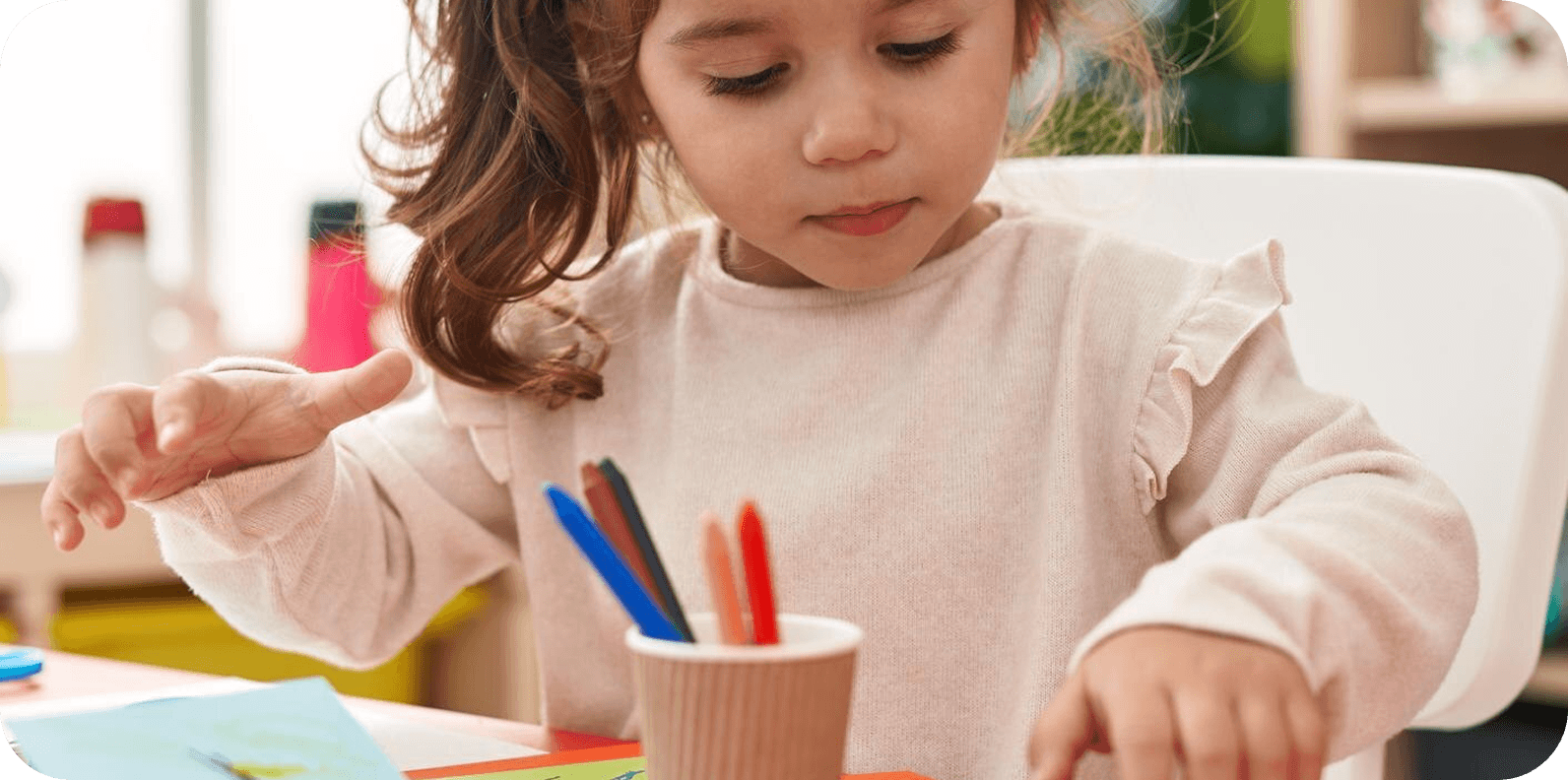 Child working on art project at desk