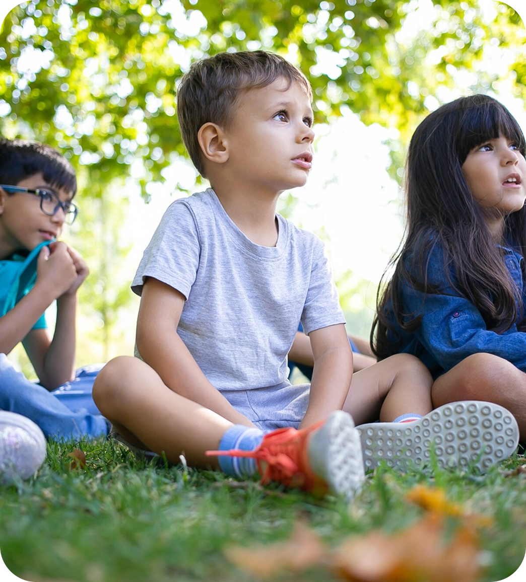 Kids sitting on grass